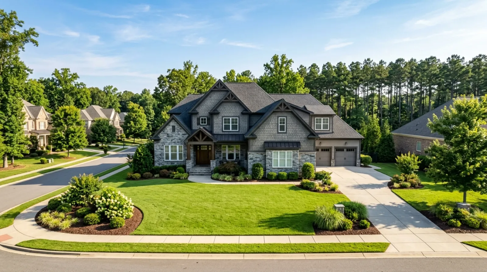 A large newer home with stone and shake siding in a Huntersville subdivision
